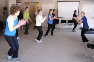 OT Charlene Feakins leads one of the Tuesday Seniors Exercise Classes in a heart pumping set of hamstring curls